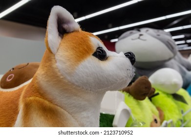 Close-up Of The Stuffed Toy Dog Shiba Inu. High Quality Photo