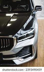 Close-up of stylish gray car luxury front headlight design outdoors. High quality photo - Shutterstock ID 2393490459
