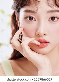 Close-Up of a Stylish Model with Soft Makeup and Elegant Pose, Highlighting Radiant Skin and Feminine Beauty in Natural Light