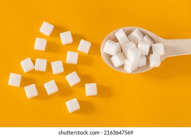 Closeup Sugar Cubes On Wooden Spoon White Yellow Background