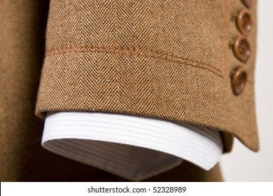 Closeup Of Suit, Detail Of Brown Cuff And White Shirt