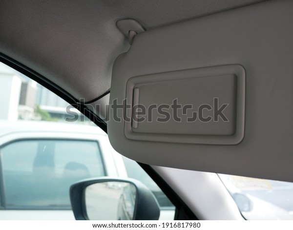 closeup of sun visor\
with mirror in a car.