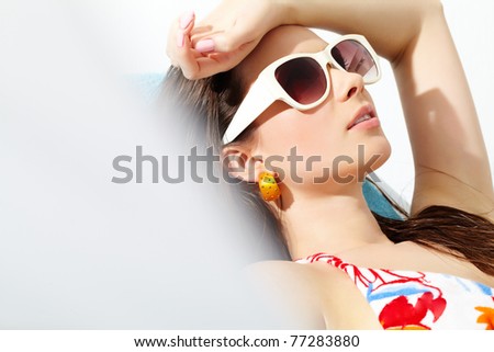 Similar – Woman applying sunscreen by the pool during summer