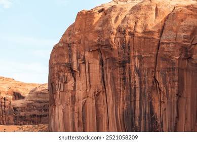 Close-up of sunlit sandstone cliff textures in Monument Valley desert. - Powered by Shutterstock