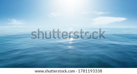 Closeup surface of calm ocean blue sea water with sunshine and clouds behind. Abstract Background Texture.