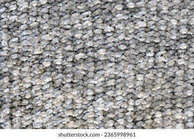 Close-up of the surface of a gray wool carpet. High resolution photo.