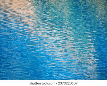 Close-up of the surface of a mountain turquoise lake covered with ripples. Background image. Clear water of a mountain lake. - Powered by Shutterstock