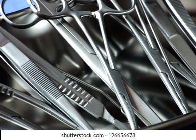 closeup surgical instruments in kidney tray