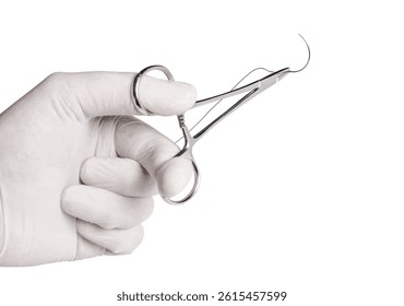 Close-up of a surgical needle threaded with non-absorbable suture. Sharp point and fine thread against a white background.