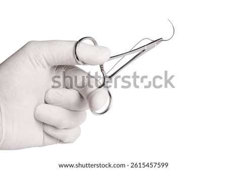 Close-up of a surgical needle threaded with non-absorbable suture. Sharp point and fine thread against a white background.