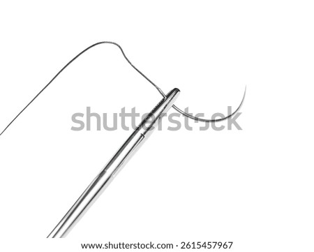 Close-up of a surgical needle threaded with non-absorbable suture. Sharp point and fine thread against a white background.