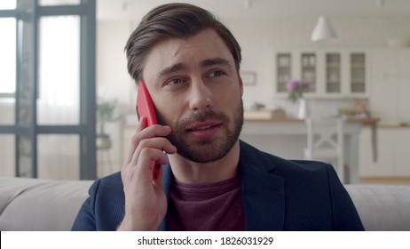 Closeup Surprised Business Man Talking Mobile Phone At Remote Workplace. Portrait Of Wondered Guy Having Phone Call At Home Office. Freelancer Man Saying No In Slow Motion.