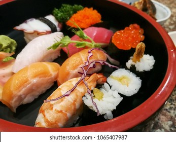 Closeup Sushi In The Black Japanese Lacquer Tray.