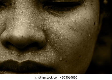 Closeup of sweating water drop on face asian woman. Sport female exercise in fitness.