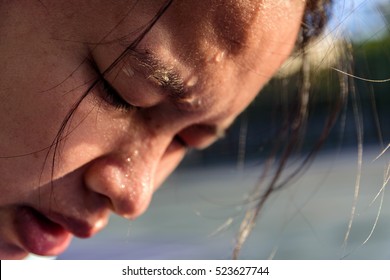 Closeup Of Sweating Water Drop On Face Asian Woman. Sport Female Exercise In Fitness.