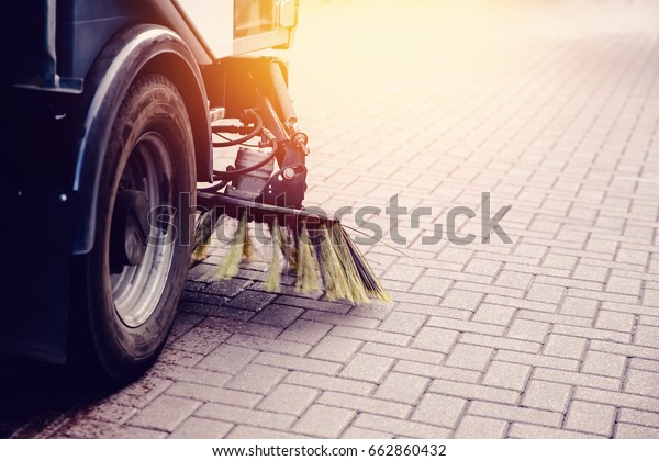 Close-up sweeper machine cleaning. Concept clean\
streets from debris.