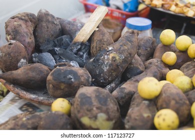 Close-up Of Sweet Potatoes With Lemons At A Chaat Stall, New Delhi, India