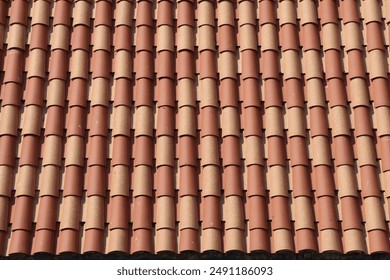 Close-Up of Symmetrical Terracotta Roof Tiles in Sunshine - Powered by Shutterstock