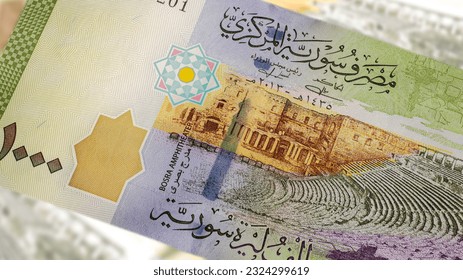 A close-up of a Syrian 1000 Pound banknote reveals intricate art and design. Amidst the country's turmoil, it showcases historical landmarks, symbolizing resilience and hope for a brighter future - Powered by Shutterstock