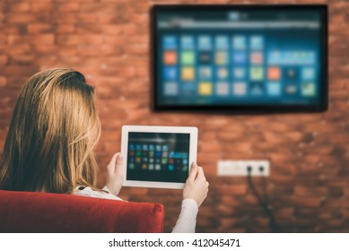 Closeup of a tablet is connected to a smart TV.