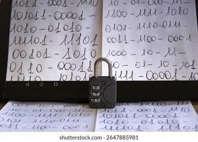 close-up of a tablet screen displaying handwritten binary code, with a combination padlock resting in front, symbolizing data security