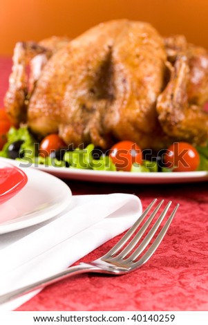 Close-up of tableware with part of roasted turkey on Christmas dinnertable
