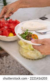 Close-up Of Taco And Green Lentil Salad On A White Plate In The Woman's Hand. Vegetarian And Healthy Diet.