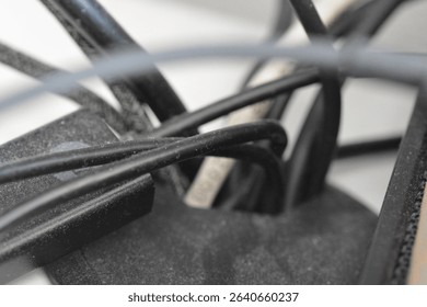 Close-up of tangled black cables.
