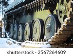 Close-Up of Tank Tracks in Snowy Environment - Military Vehicle Winter Warfare