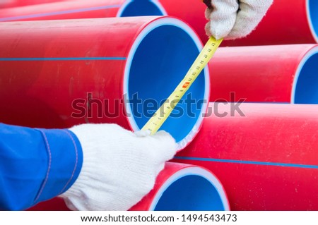 close-up, tape measures for measuring the diameter of plastic pipes, for laying electrical cables