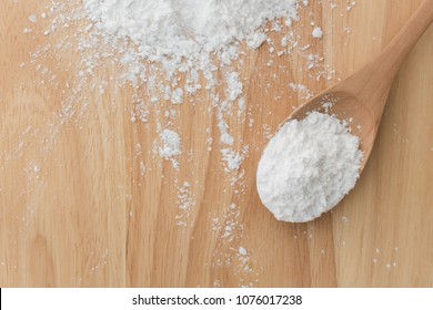 Close-up Of Tapioca Starch Or Flour Powder In Wooden Spoon With Wooden Background