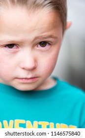 Closeup of teary eyed little boy