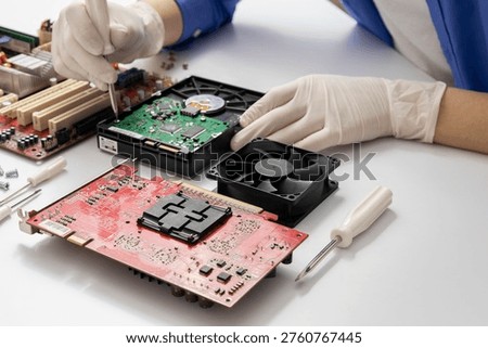 Closeup of technical support worker`s hands who wearing whte gloves and using tool for fixing computer details