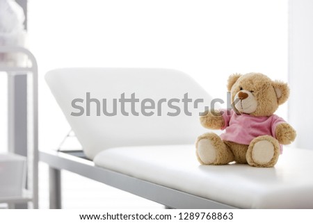 Closeup of teddybear on bed at hospital