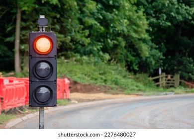 Close-up of temporary portable traffic signal  installed for road works