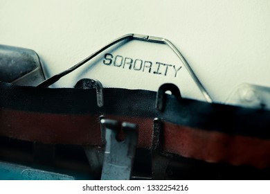 Closeup Of The Text Sorority Written With An Old Typewriter On A Yellowish Paper