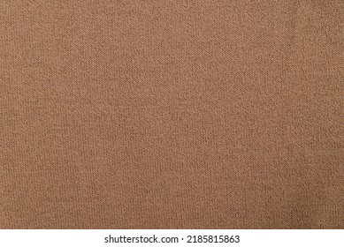 Closeup Texture Of Brown Knitted Sweater.