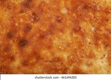 Close-up Texture Of A Cheesecake Crust As A Background Composition