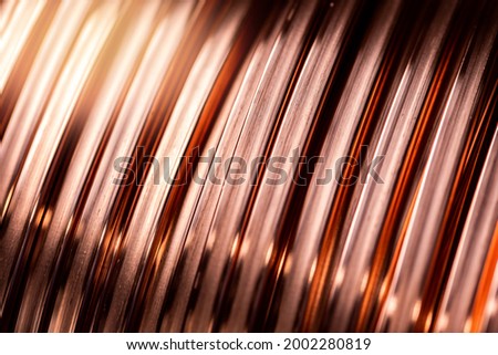 Closeup texture copper cable rolled coil up on industry factory.