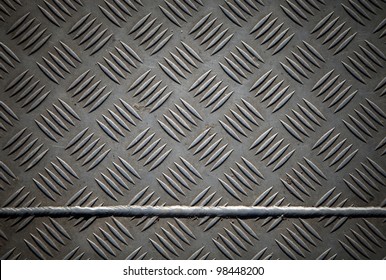 Closeup texture of diamond metal plate with joint