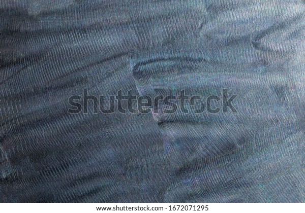 Close-up texture of flat steel surface\
manually cleaned with a flap wheel angle\
grinder.
