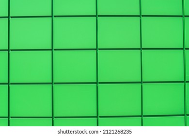 Close-up, Texture Of The Green Metal Panel Of A Modern Building. Abstract Backgrounds For Design