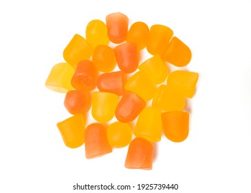 Close-up Texture Of Orange And Yellow Multivitamin Gummies. Healthy Lifestyle Concept.