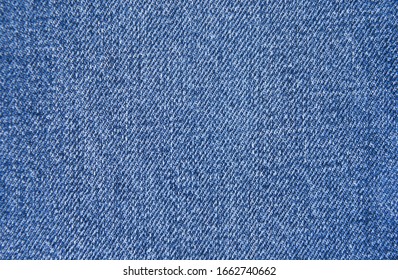 Closeup texture and pattern of shabby soft jeans fabric


