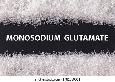 Closeup Texture Umami On Dark Background With Text Monosodium Glutamate . Sodium Salt (MSG, E621) Used As Flavor Enhancer. Food Ingredient.