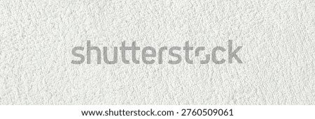 Close-up texture of white soft terry fabric creating cozy and comfortable background.