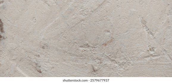 Close-up of a textured off-white surface with subtle brown speckles and visible brush strokes.