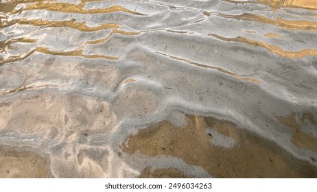 Close-up of a textured surface with embedded translucent crystals, showcasing natural patterns and geological interest in a detailed and organic composition.