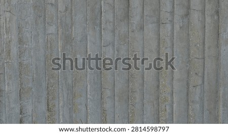 Close-up of textured, weathered surface characterized by vertical grooves and prominent horizontal cracking. This appearance is highly characteristic of rough-cast or board-marked concrete, Saaremaa, Estonia, Europe.