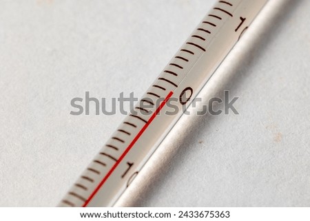 Close-up of a thermometer showing precise temperature scales